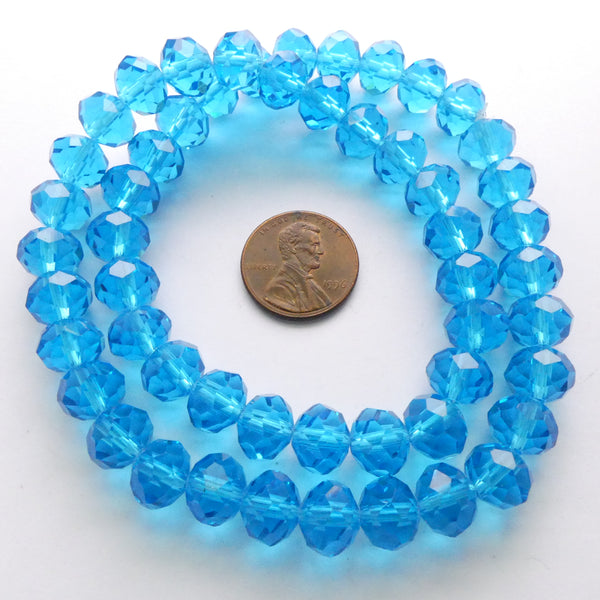 Faceted Glass "Dragon Crystal" 8x10mm Aqua Dark on 16-inch Strands