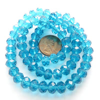 Faceted Glass "Dragon Crystal" 6x8mm, Translucent Dark Aqua, 16-inch Strands
