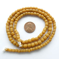 Indonesian Spacer Beads, 4-6mm Amber Matte, 23" Strands