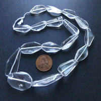 Rock Crystal, Baroque flat nuggets, largest 1-1.5 inches on 16-inch Strands