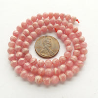 Rhodochrosite, 5mm Round on 16-inch Strands