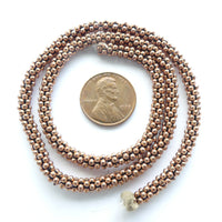 Copper "Daisy Spacers" on 14.5 inch Strand, 2mm Diameter
