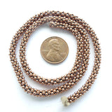 Copper "Daisy Spacers" on 14.5 inch Strand, 2mm Diameter
