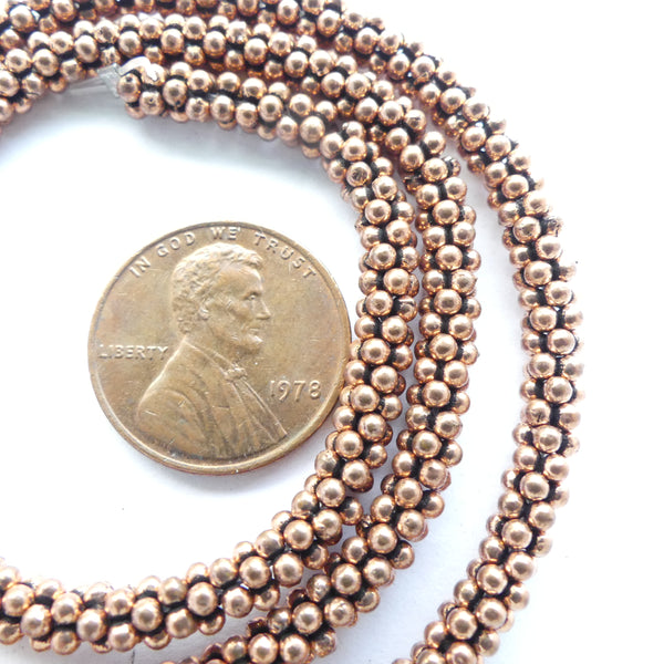 Copper "Daisy Spacers" on 14.5 inch Strand, 2mm Diameter