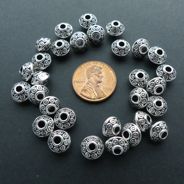 Cast Antiqued White Metal Decorated Bicones 6x8mm, Bag of 30 grams