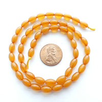 Resin Amber Semi-translucent Ovals 9x5mm on 16" Strands